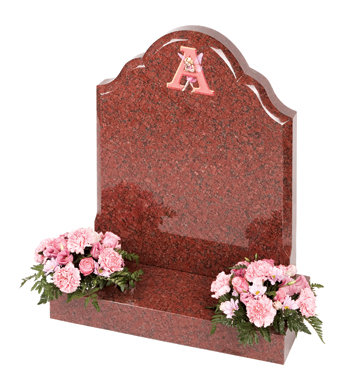 Ruby red granite children-s headstone with unique fairy-tale lettering.