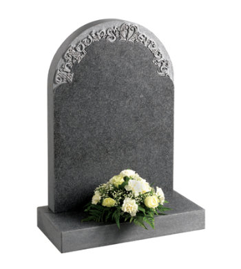 Honed south african dark grey granite headstone with decorative carved letters.