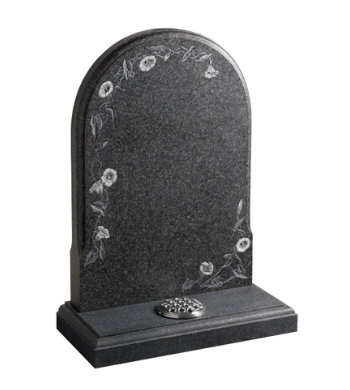 Honed south african dark grey granite memorial with carved flowers.