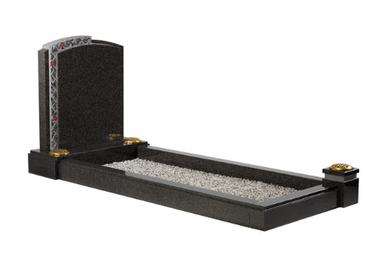 South African dark grey granite kerb memorial with intricately carved lattice work and contrasting material finishes.