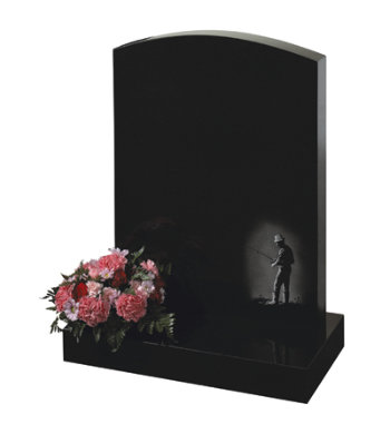 Black granite headstone of camber top shape with etching of fisherman.