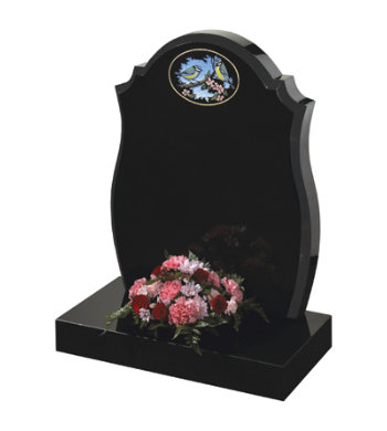 Black granite headstone with centre round, checked shoulders and barrel sides.