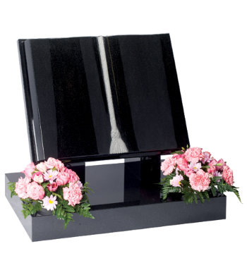 Black granite book shaped headstone with fully carved book and natural tassel.