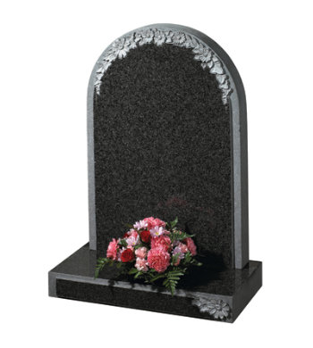 Part polished South African dark grey granite with carved flowers to headstone and base.