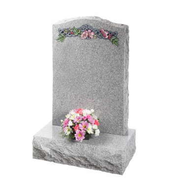 Cathay grey granite headstone with pitched edges and carved celtic knot and flowers.