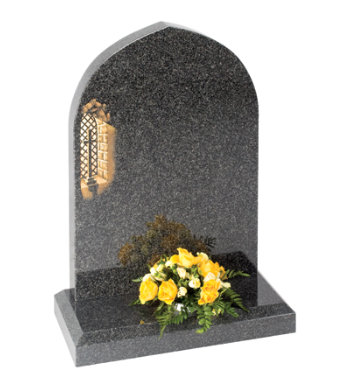 South African dark grey granite headstone with gothic top and chamfered base.