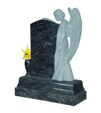 Lavender blue granite headstone with angel sculpture overlooking from the right.