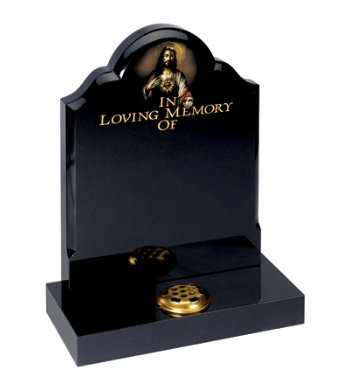 Black granite headstone with centre round, ogee shoulders and 1inch chamfer.