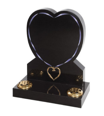 Black granite heart shaped headstone with intricately carved heart pendant.