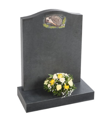 Honed black granite headstone with ogee top and decorative wildlife carving.