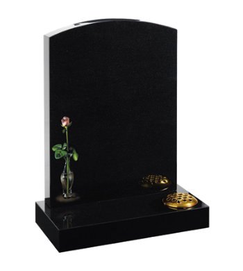 Black granite headstone of camber top with delicate rose in vase design.