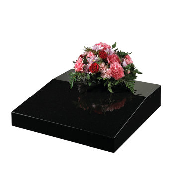 Black granite desk with flat for flower container or vase.