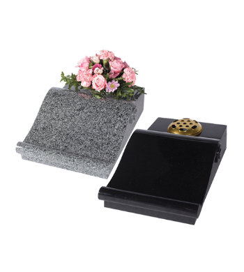 Black granite and impala grey desks with flat for flower container or vase and raised scroll.